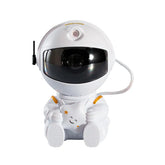 Astronaut LED star projector night light and desk lamp, creates a galaxy effect for bedrooms or relaxation spaces.